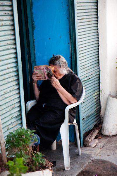 Old Woman Reading in Crete, Greece